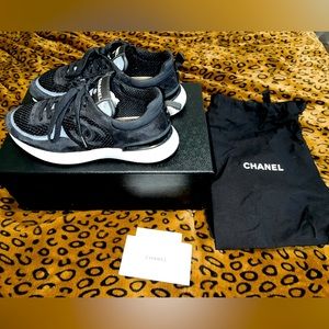 Chanel sneakers size 38.5. Comes with box, dust bags, receipts, and laces.